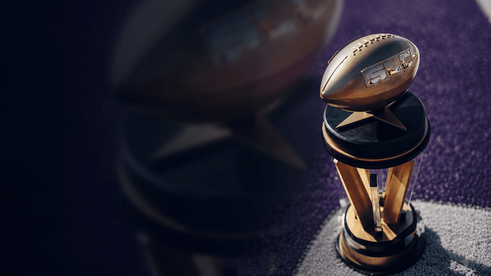 Southland Conference championship trophy on a football field.